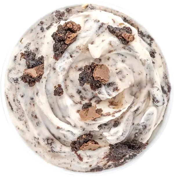 Cookies and cream ice cream with chunks of chocolate brownie, top view. Indulgent dessert treat.