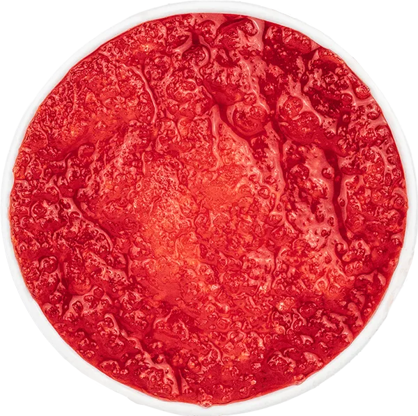 Bright red Slushie in a round container, highlighting its fresh and vibrant texture