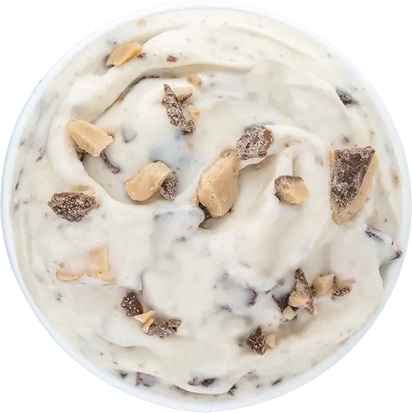 Creamy vanilla ice cream with chocolate chunks and toffee bits, top view dessert close-up.
