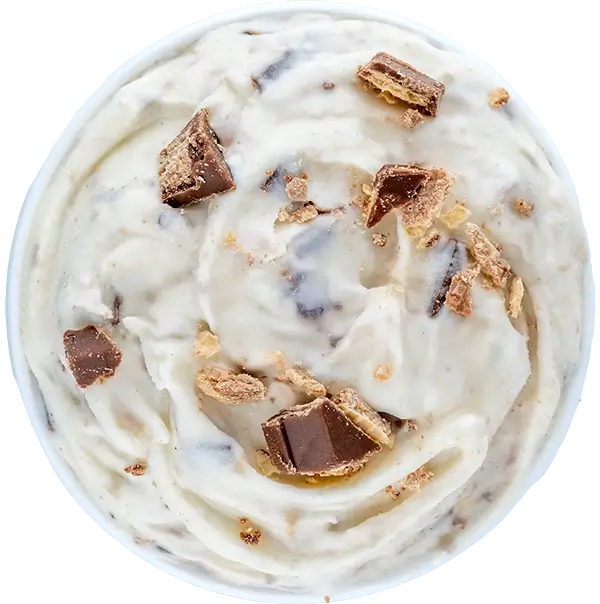 Creamy ice cream with chocolate chunks and crumbles in a bowl, top view. Indulgent dessert treat.