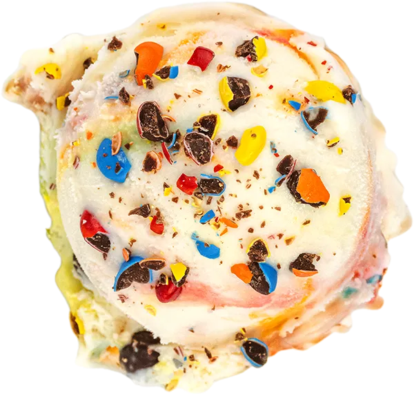 Colorful ice cream scoop with candy toppings, featuring vibrant blue, red, and yellow pieces on creamy white ice cream.