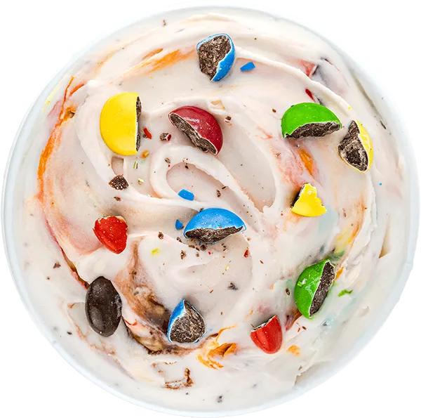 Creamy vanilla ice cream swirl with colorful chocolate candy pieces on top.