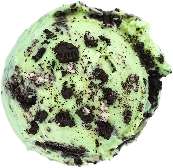 Mint chocolate chip ice cream scoop with cookie crumbles on top. Delicious dessert treat for summer refreshment.