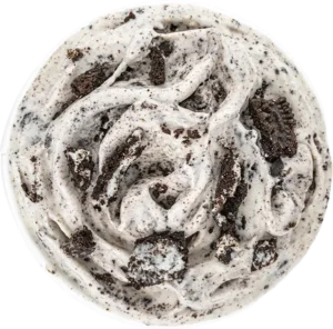 Creamy cookies and cream ice cream with chocolate cookie chunks in a bowl, top view.