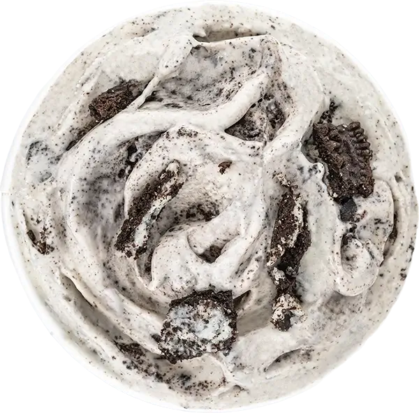 Creamy cookies and cream ice cream with chocolate cookie chunks in a bowl, top view.