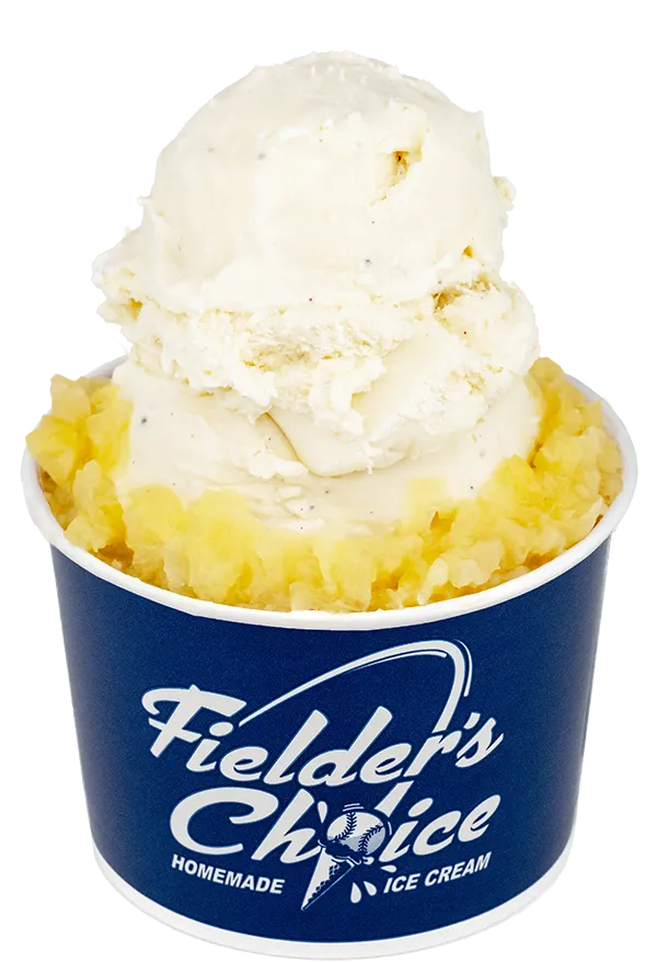 Vanilla ice cream in blue Fielder's Choice cup, topped with pineapple, a delicious homemade dessert treat.