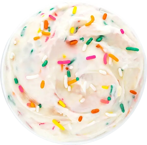 Colorful sprinkles on creamy vanilla icing, top view. Perfect dessert for birthdays and celebrations. Indulgent treat!