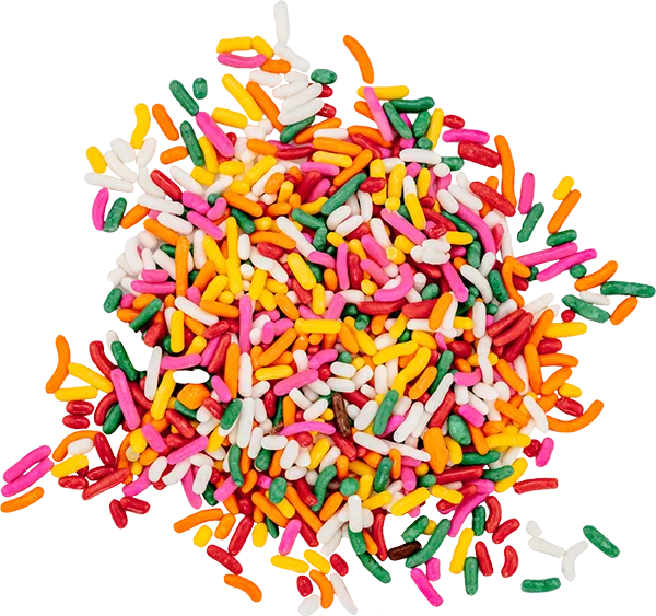 Colorful candy sprinkles scattered on a white background, ideal for decorating desserts and baked goods.