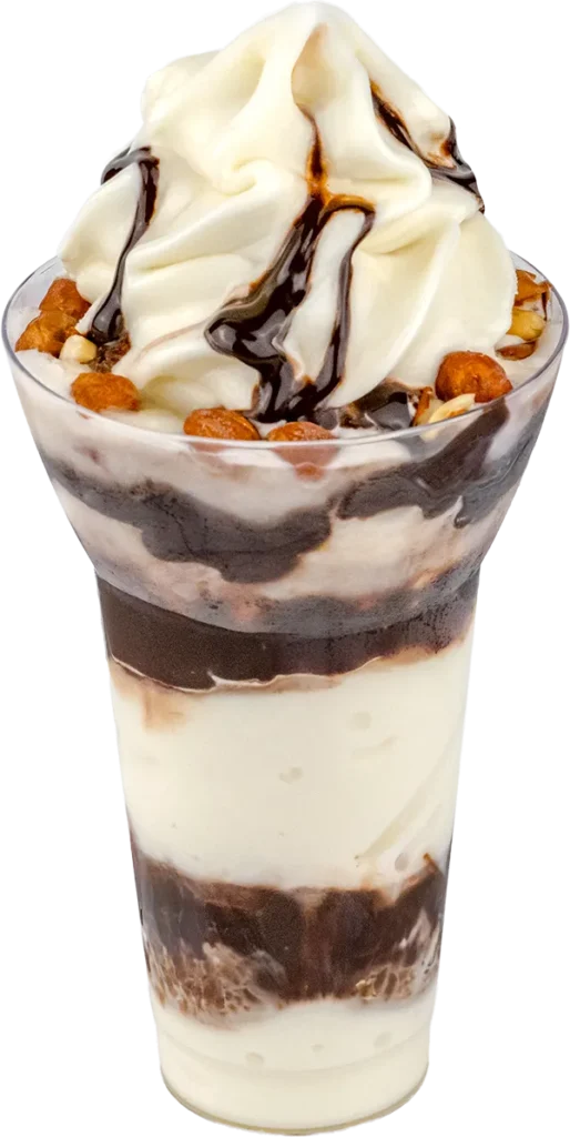 Creamy vanilla and chocolate sundae with nuts and chocolate syrup in a clear cup, perfect dessert treat.