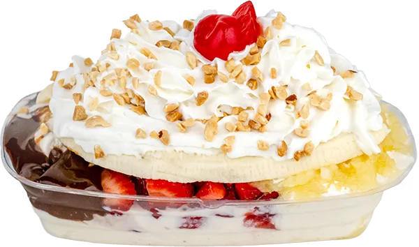 Delicious banana split topped with whipped cream, nuts, and a cherry, featuring chocolate and strawberry scoops.