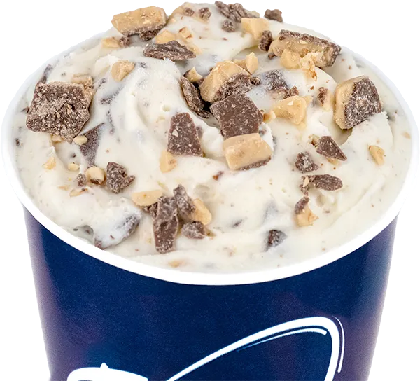 Creamy vanilla ice cream with chocolate and toffee pieces in a blue cup—perfect indulgent treat.